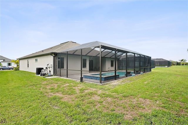 back of property featuring a yard and a lanai