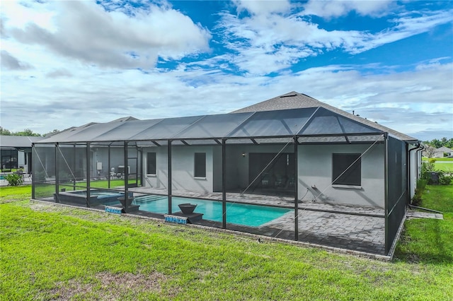 back of property featuring a lanai and a yard