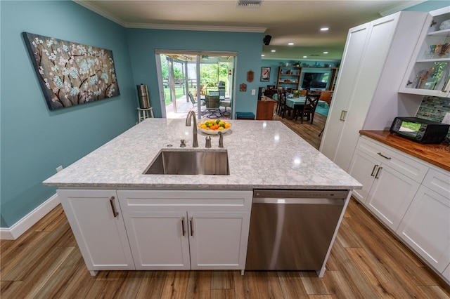 kitchen with white cabinetry, stainless steel dishwasher, and sink