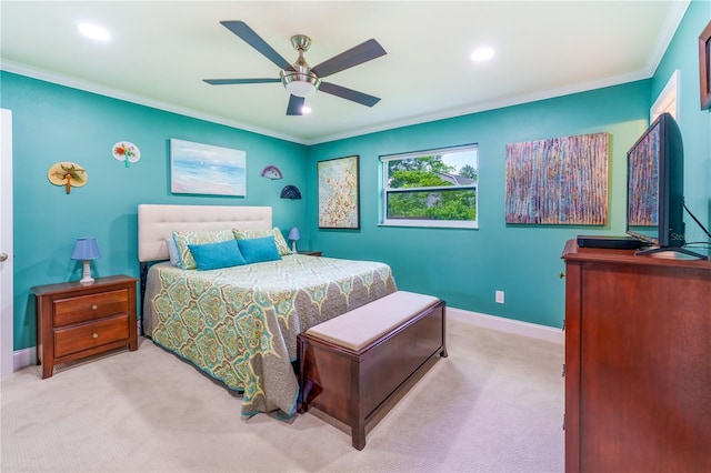 bedroom with light colored carpet, ceiling fan, and crown molding