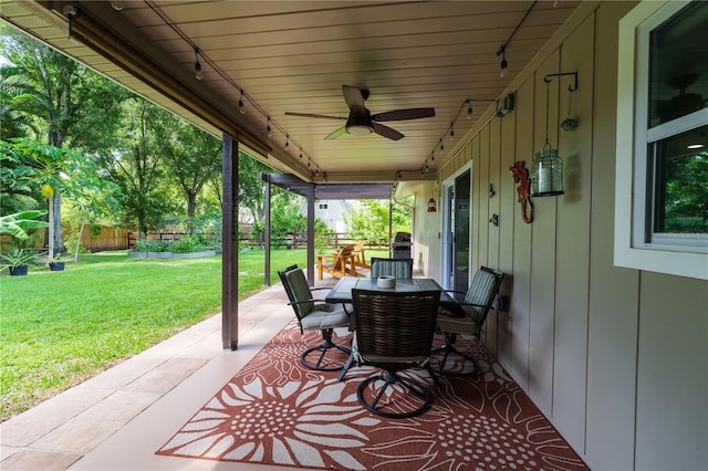 view of patio featuring ceiling fan