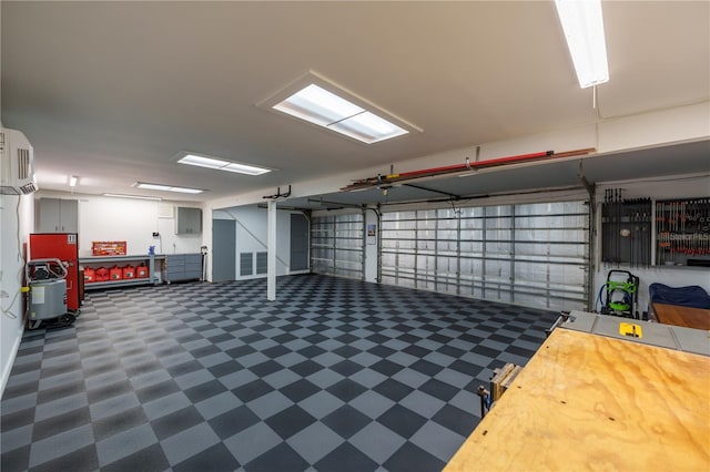 garage featuring a wall mounted AC