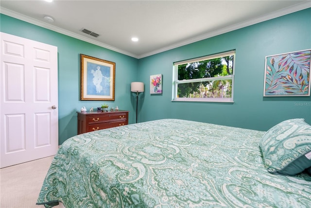 bedroom with light colored carpet and ornamental molding