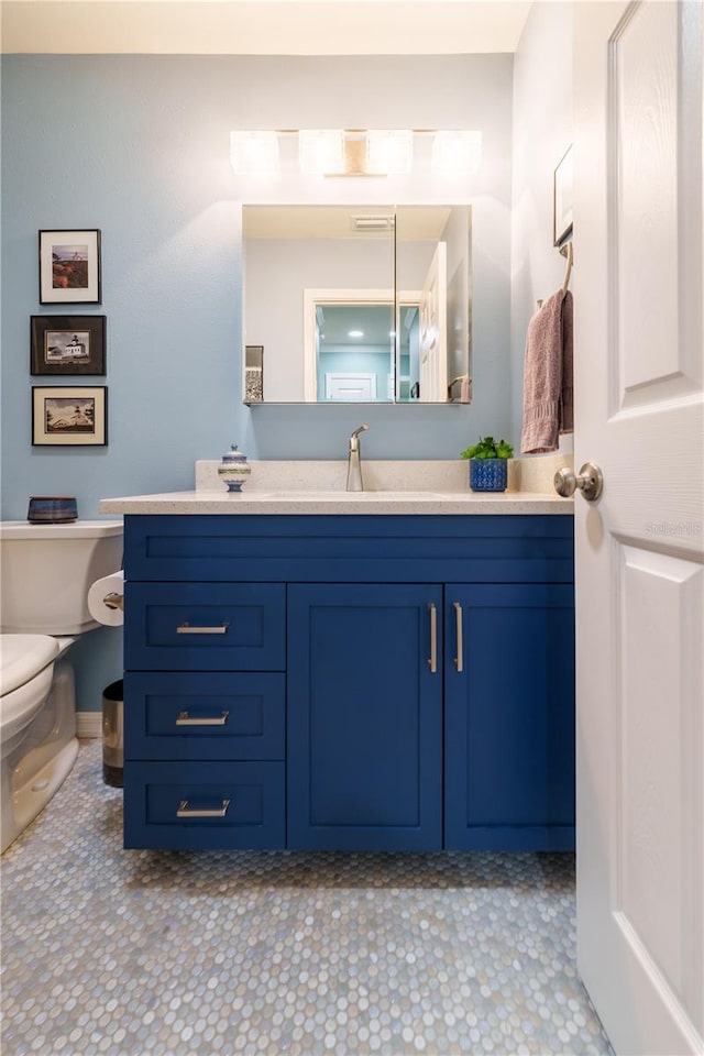 bathroom with vanity and toilet