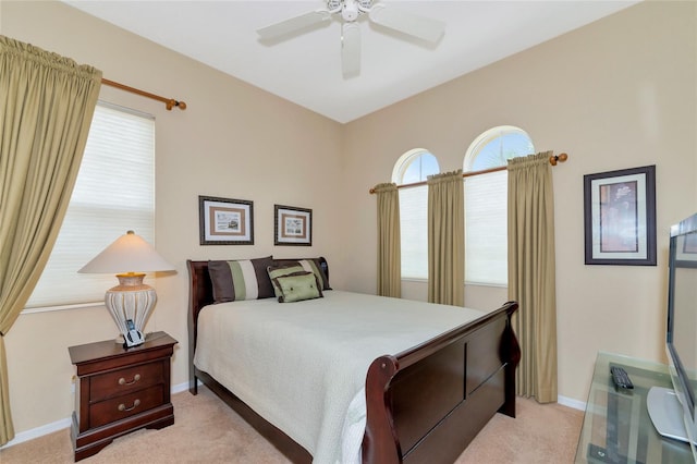 bedroom featuring light carpet and ceiling fan