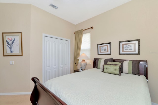 bedroom with a closet and carpet floors