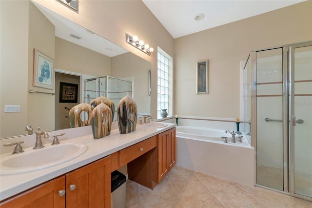 bathroom with tile floors, dual vanity, and separate shower and tub