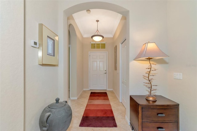 tiled foyer entrance with ornamental molding