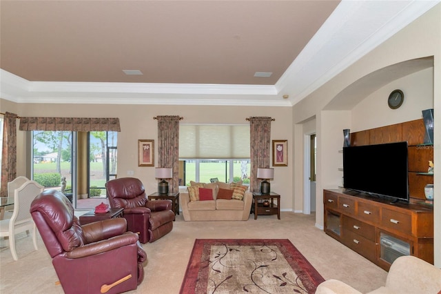 living room with plenty of natural light, carpet floors, and crown molding