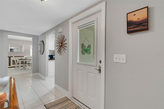 entrance foyer featuring light tile patterned floors