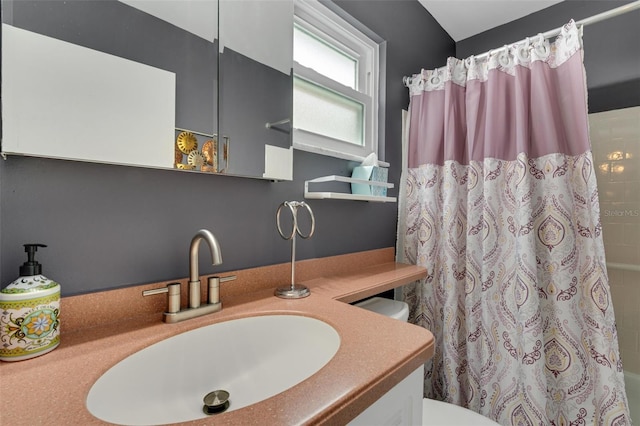 bathroom featuring vanity and toilet