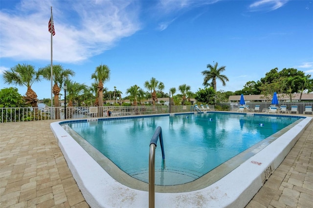 view of swimming pool with a patio area