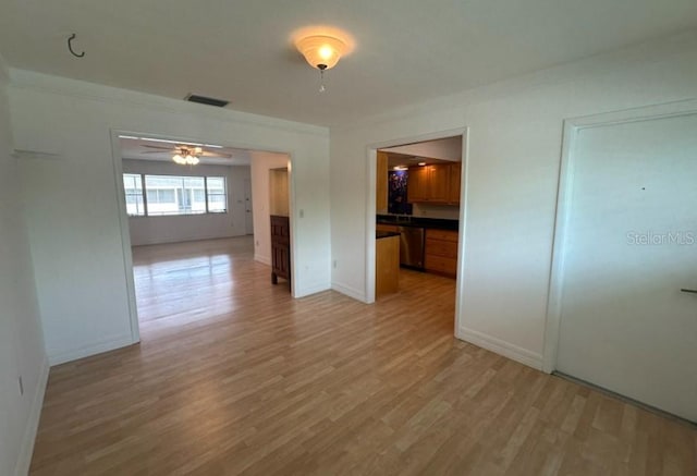 spare room with light hardwood / wood-style floors