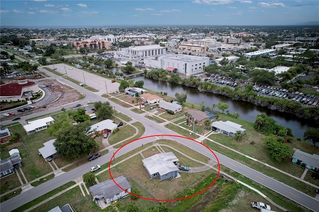 birds eye view of property featuring a water view