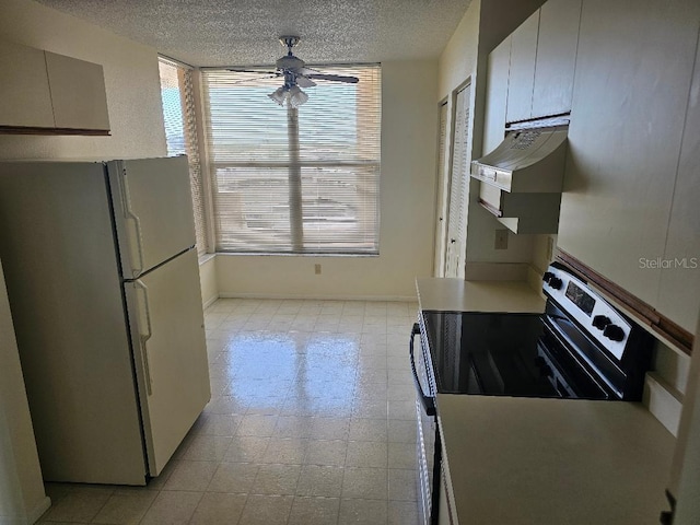 kitchen featuring white refrigerator, electric range, premium range hood, and light tile patterned floors