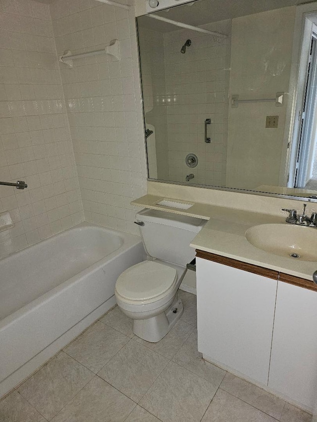 full bathroom with tiled shower / bath combo, vanity, tile patterned flooring, and toilet