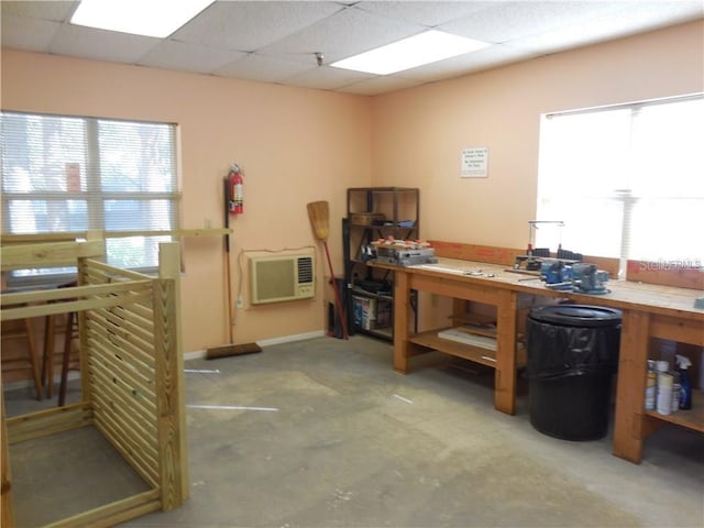 4410 Fairways Blvd Unit 602, Bradenton, FL 34209 - office with a workshop area, heating unit, a paneled ceiling, and concrete flooring