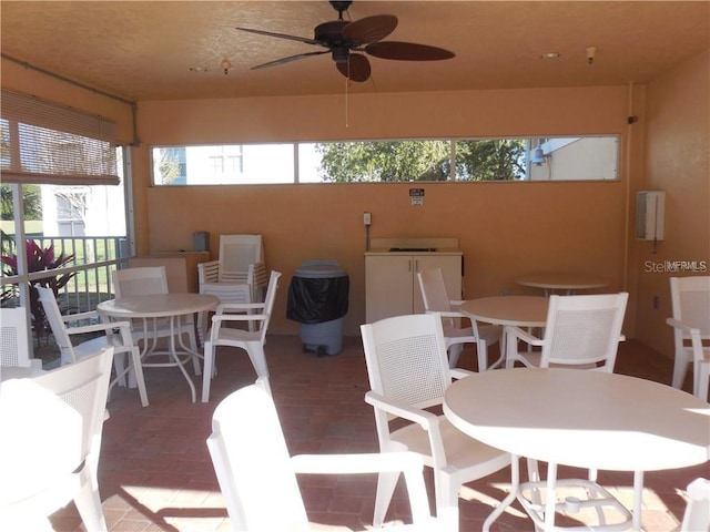 sunroom / solarium with ceiling fan