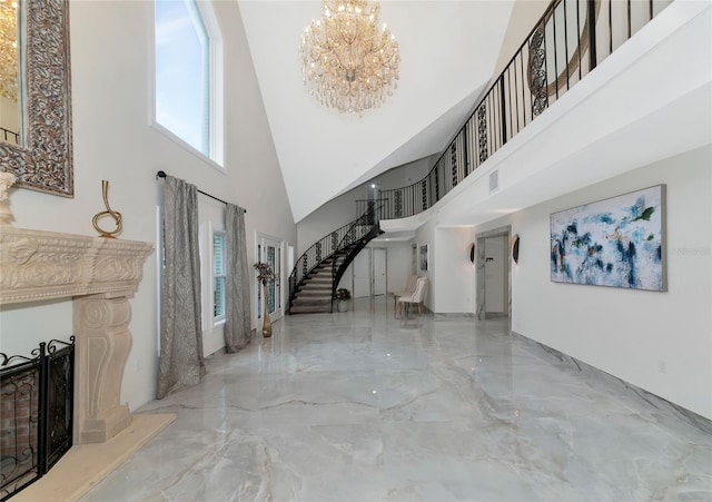 foyer entrance featuring a chandelier and a high ceiling