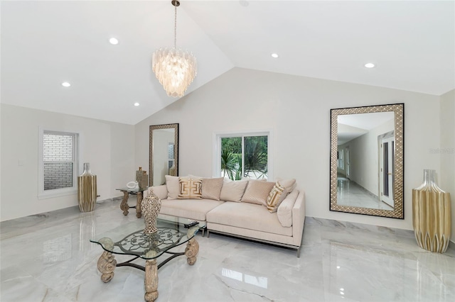 living room featuring a chandelier and lofted ceiling