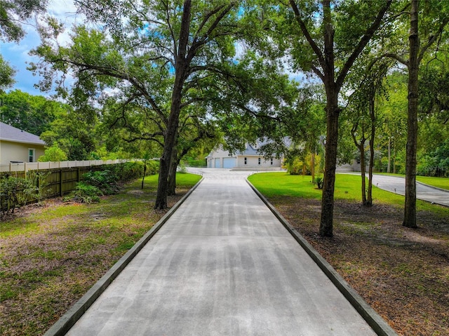 view of property's community with a yard