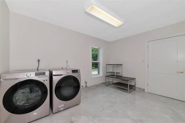 laundry room with washing machine and clothes dryer