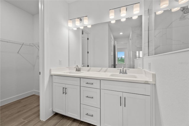 bathroom with vanity and hardwood / wood-style flooring