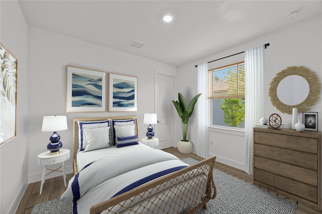 bedroom featuring hardwood / wood-style flooring