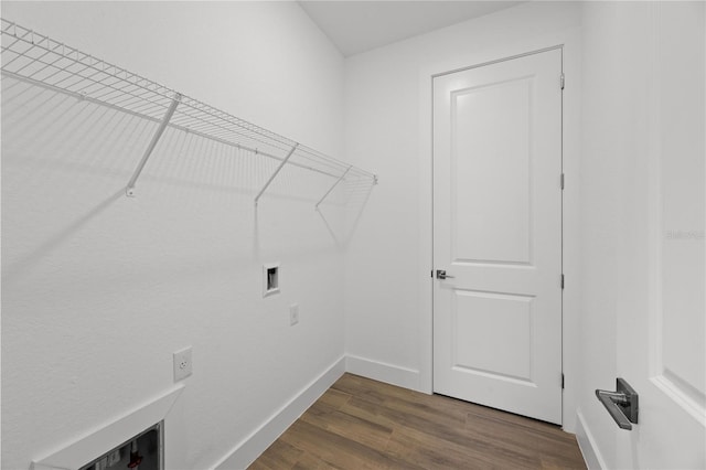 laundry room featuring washer hookup and dark hardwood / wood-style flooring