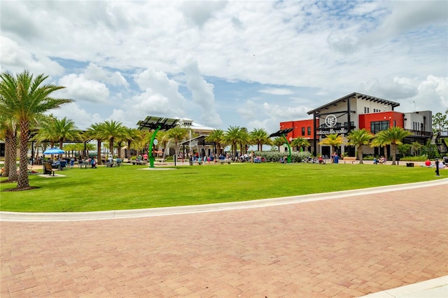 view of home's community featuring a lawn