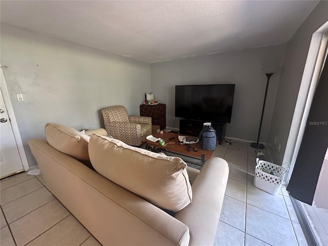 tiled living room with a textured ceiling