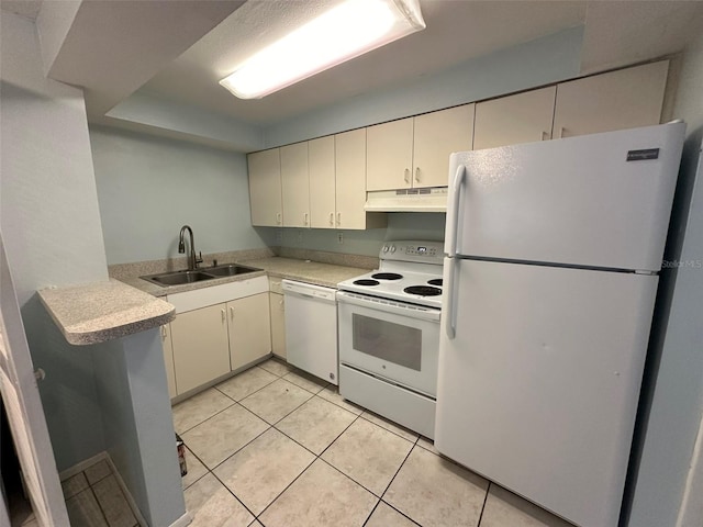 kitchen featuring sink, white appliances, kitchen peninsula, and light tile patterned flooring