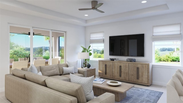 living room featuring ceiling fan, light tile patterned floors, and a healthy amount of sunlight