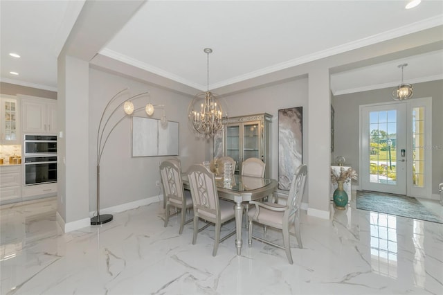 dining room featuring crown molding and a chandelier