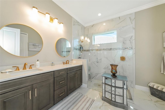 bathroom with a tile shower, vanity, and crown molding