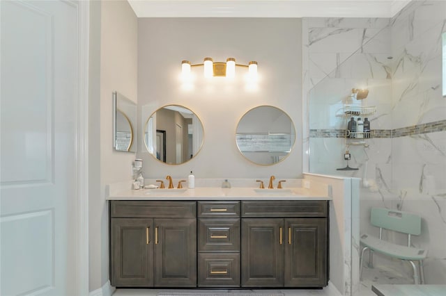 bathroom with a tile shower and vanity