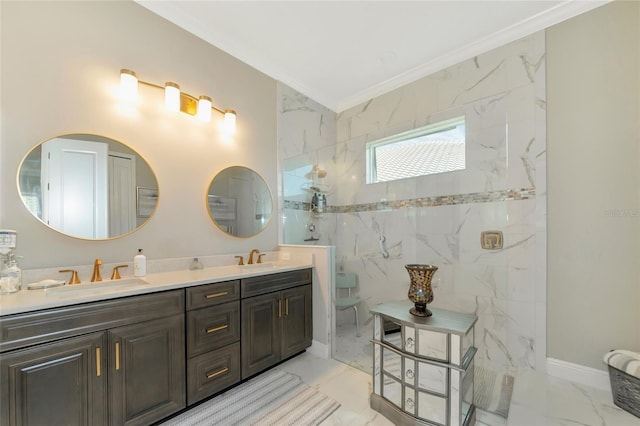 bathroom with tiled shower, vanity, and crown molding