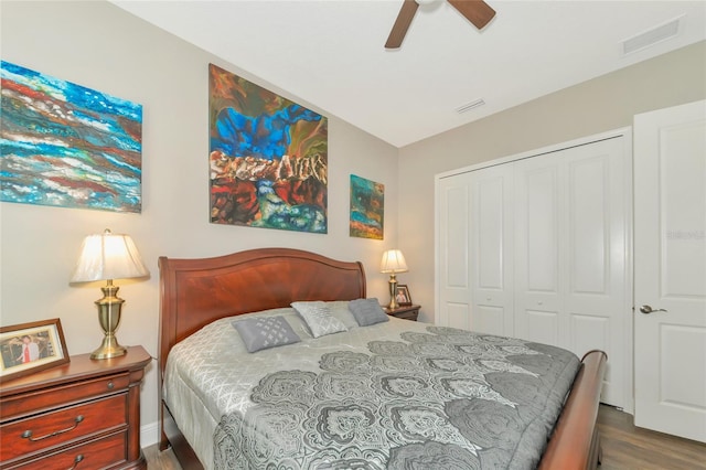 bedroom with ceiling fan, light hardwood / wood-style flooring, and a closet