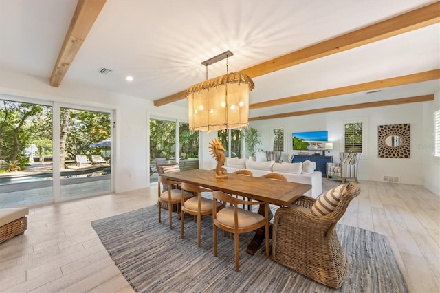 dining room featuring hardwood / wood-style flooring and beamed ceiling