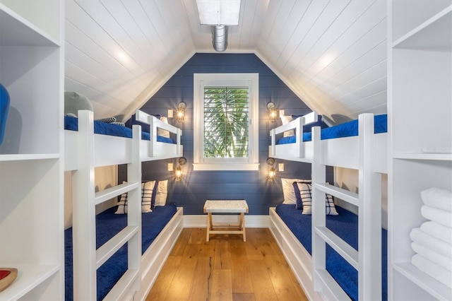 interior space featuring lofted ceiling and hardwood / wood-style floors