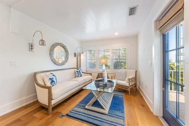 living room with light hardwood / wood-style flooring