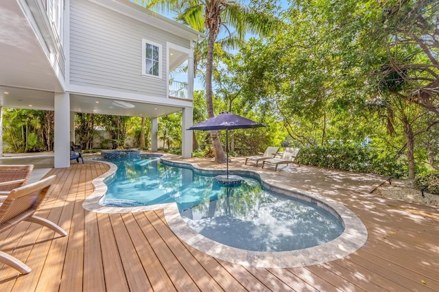 view of pool featuring a patio and a deck