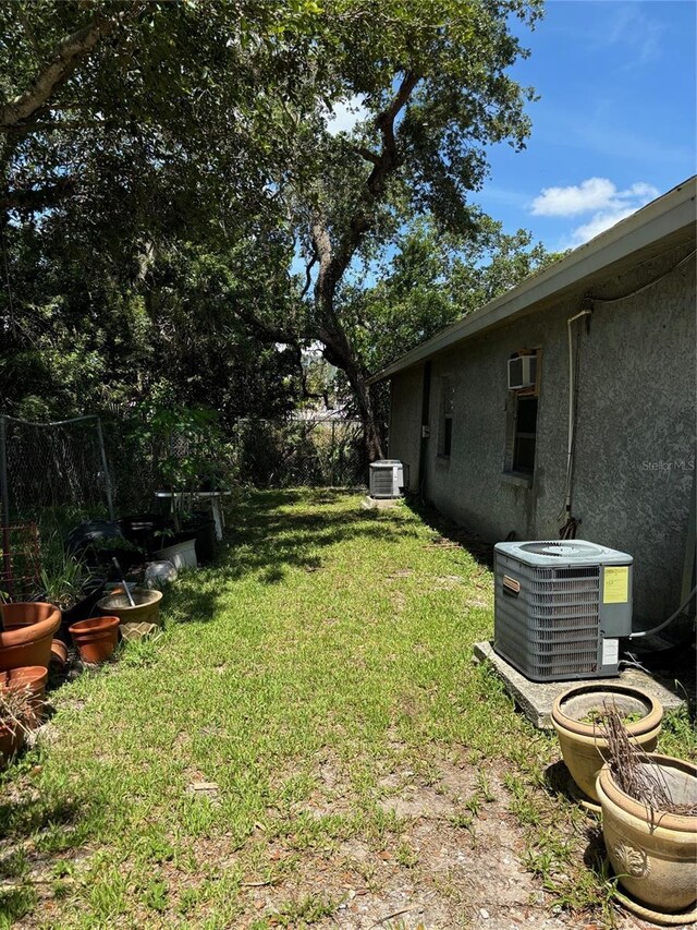 view of yard featuring central air condition unit