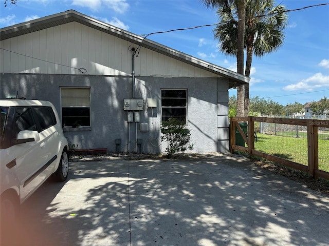 view of side of home with fence