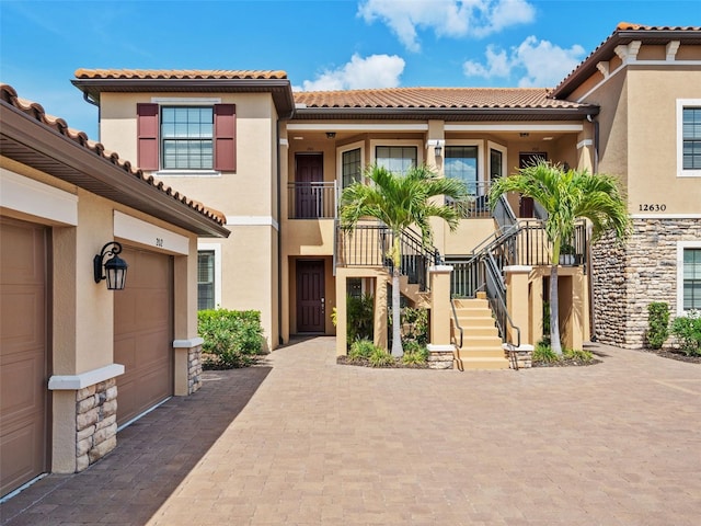 mediterranean / spanish house with a garage