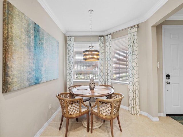 dining space featuring tile floors, crown molding, and a chandelier