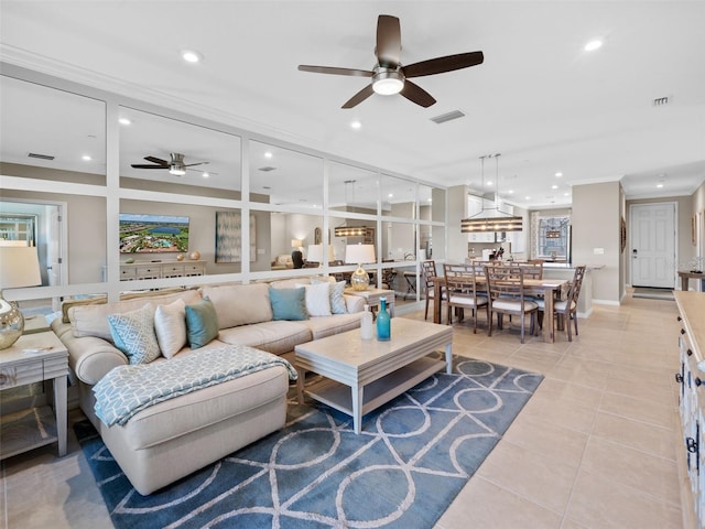 living room with ceiling fan and light tile floors