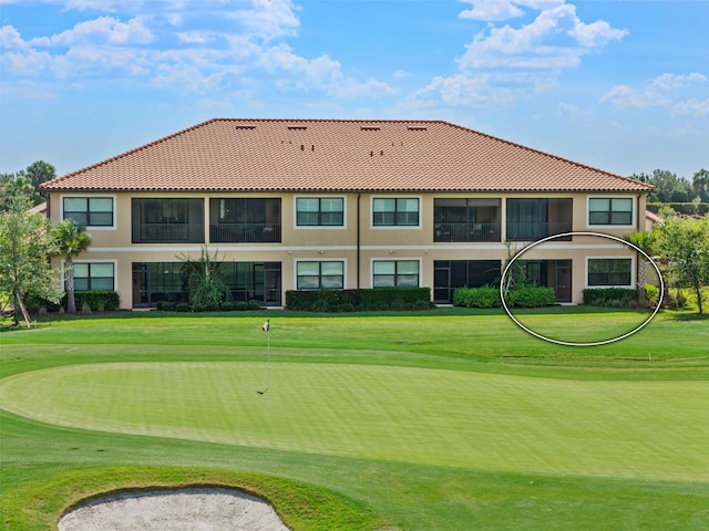 view of home's community featuring a lawn