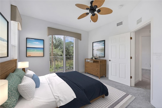 bedroom with baseboards, visible vents, and light colored carpet