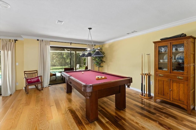 playroom featuring billiards, wood-type flooring, and ornamental molding